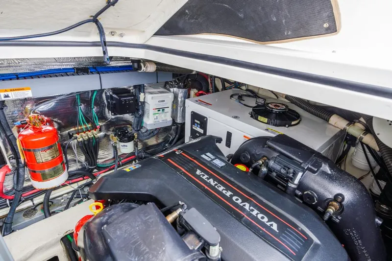 Fantasea Yacht Photos Pics Engine compartment of 2014 Regal 32 Express with Volvo Penta engine and safety equipment.