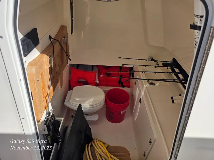  Yacht Photos Pics Interior of 2022 Boston Whaler 330 Outrage with fishing gear and safety equipment.