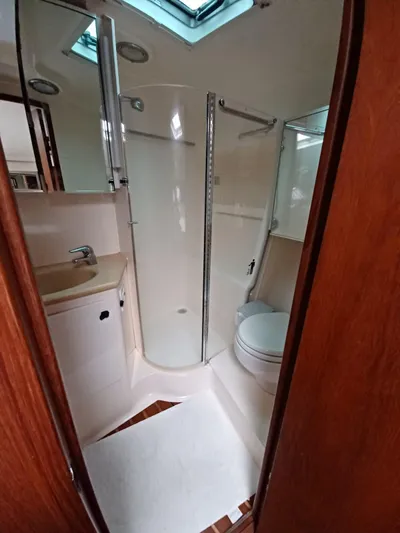  Yacht Photos Pics 2002 Tiara Yachts 4000 Express bathroom with shower, sink, and toilet.