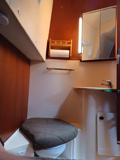  Yacht Photos Pics 2002 Tiara Yachts 4000 Express bathroom with toilet, sink, and mirror.