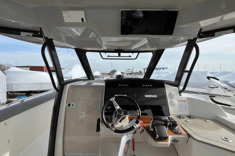 Yacht Photos Pics 2025 Boston Whaler 350 Realm helm with Simrad displays and modern controls.