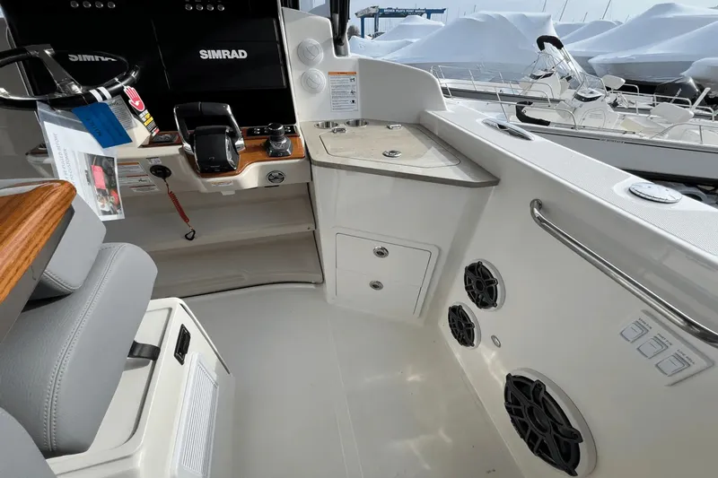  Yacht Photos Pics 2025 Boston Whaler 350 Realm cockpit with Simrad electronics and modern controls.