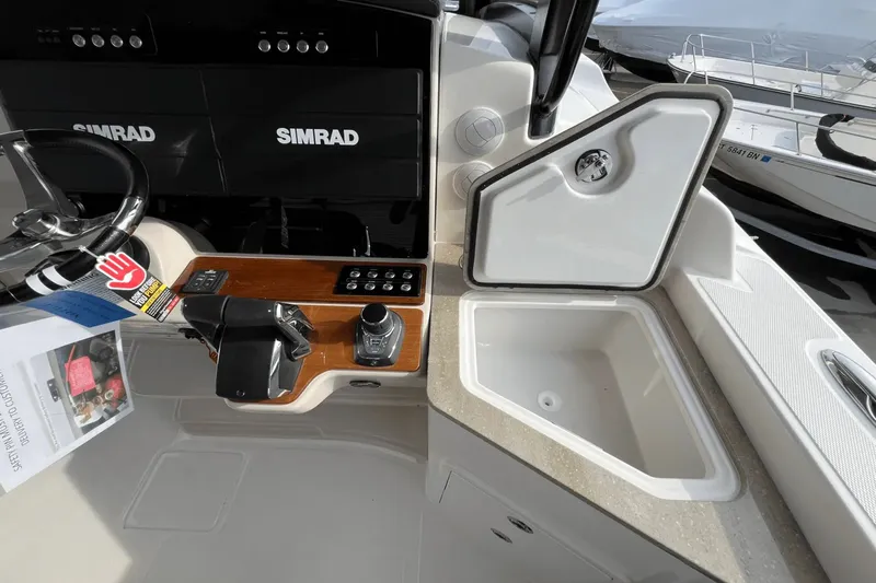  Yacht Photos Pics 2025 Boston Whaler 350 Realm helm with Simrad displays and sink.