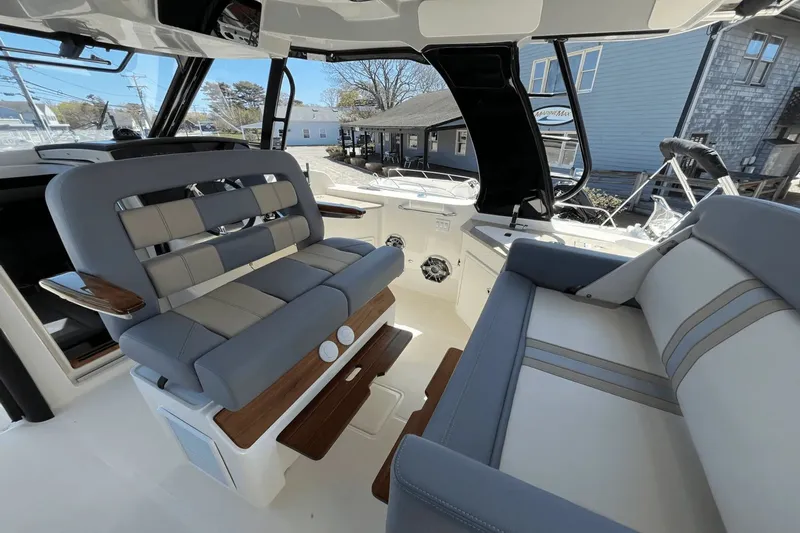  Yacht Photos Pics 2025 Boston Whaler 350 Realm interior with luxurious seating and modern design.