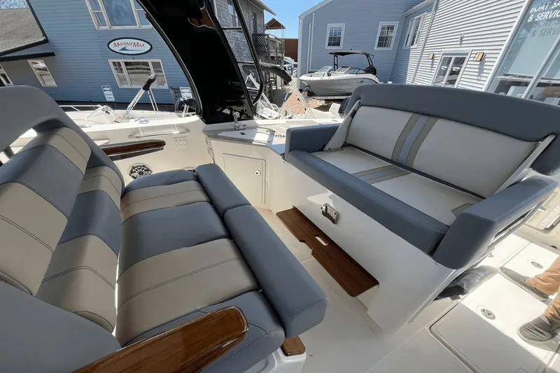  Yacht Photos Pics 2025 Boston Whaler 350 Realm interior with luxurious seating and modern design.
