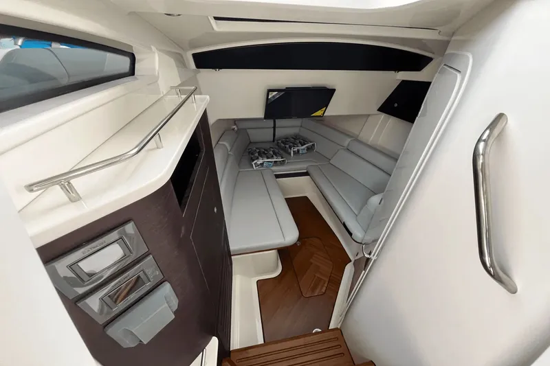  Yacht Photos Pics 2025 Boston Whaler 350 Realm cabin interior with modern seating and sleek design.