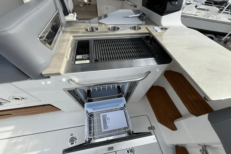  Yacht Photos Pics 2025 Boston Whaler 350 Realm boat kitchen with grill and storage drawer.