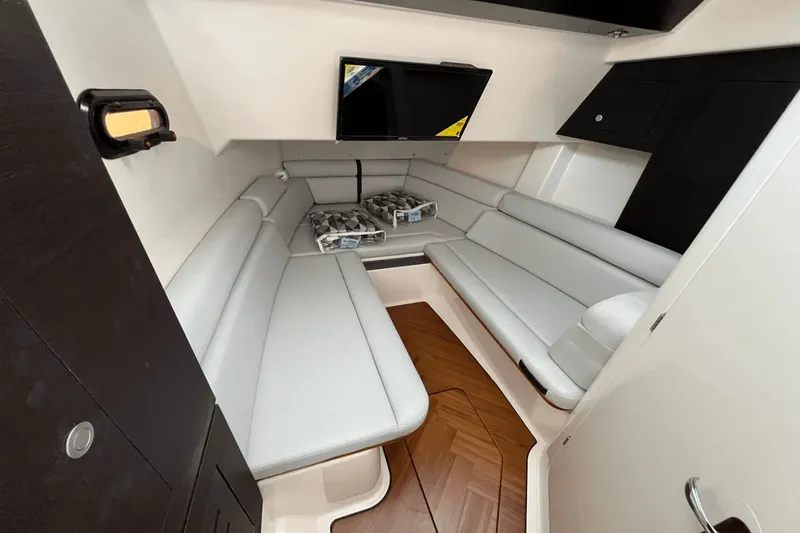  Yacht Photos Pics 2025 Boston Whaler 350 Realm cabin interior with sleek seating and modern design.