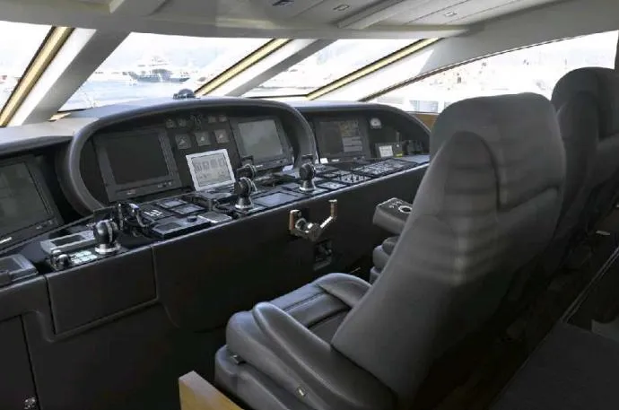 Eclat Yacht Photos Pics Luxurious cockpit of 2008 Arno Leopard 31 yacht with advanced navigation controls.