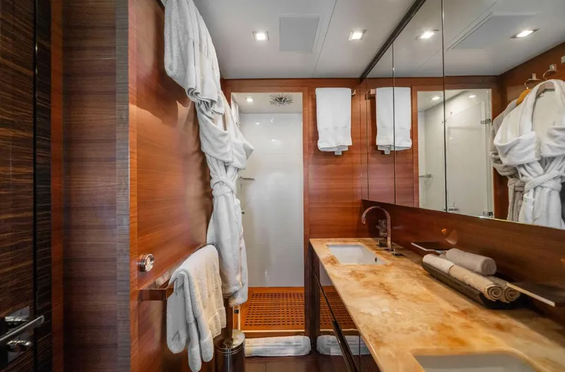 Eclat Yacht Photos Pics Luxurious yacht bathroom with wooden accents, double sinks, and plush towels. Arno Leopard 31, 2008.