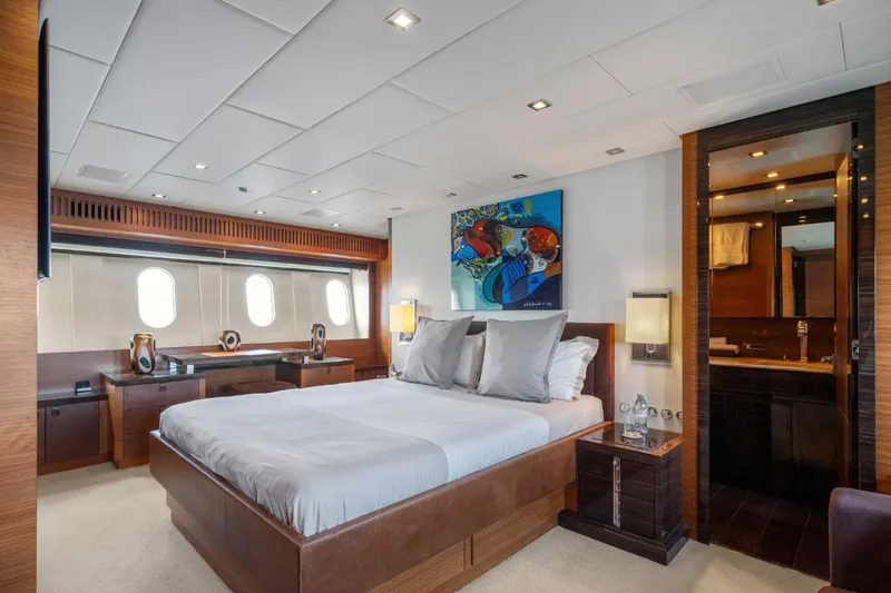 Eclat Yacht Photos Pics Luxurious bedroom interior on 2008 Arno Leopard 31 yacht, featuring modern decor and ensuite bathroom.