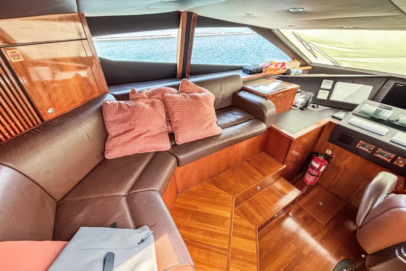  Yacht Photos Pics Luxurious interior of 2010 Sunseeker 30 Metre Yacht with leather seating and wood accents.
