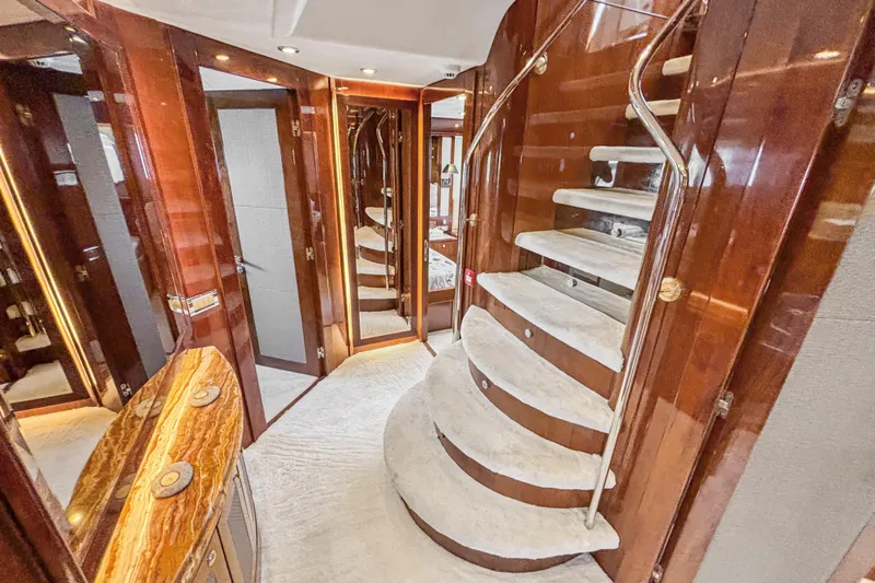  Yacht Photos Pics Luxurious interior of 2010 Sunseeker 30 Metre Yacht with elegant wooden staircase.