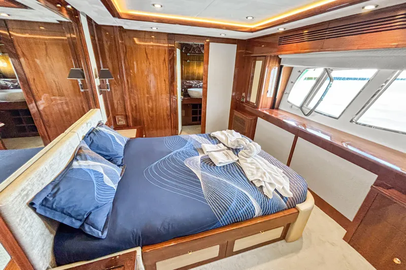  Yacht Photos Pics Luxurious bedroom interior on 2010 Sunseeker 30 Metre Yacht with elegant wood paneling.