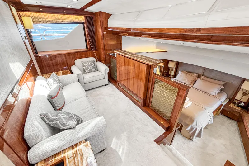  Yacht Photos Pics Luxurious interior of 2010 Sunseeker 30 Metre Yacht with elegant wood finishes and cozy seating.
