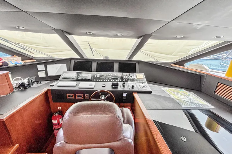  Yacht Photos Pics Cockpit of 2010 Sunseeker 30 Metre Yacht with navigation controls and leather seating.