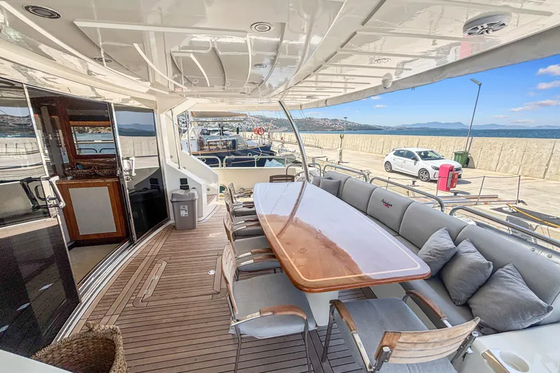  Yacht Photos Pics Luxurious Sunseeker 30 Metre Yacht 2010 with elegant outdoor dining area and scenic marina view.