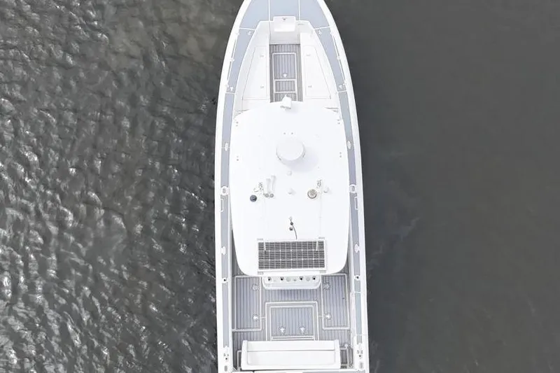  Yacht Photos Pics Aerial view of 2011 Intrepid 323 Cuddy boat on calm water.