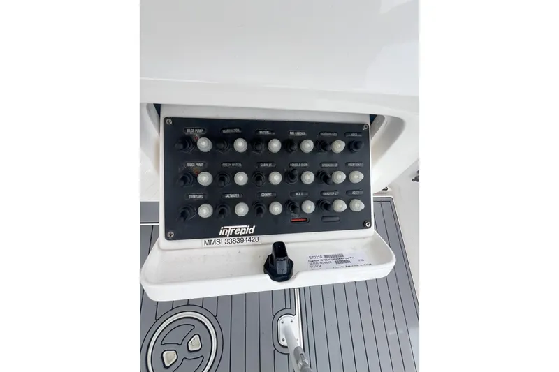  Yacht Photos Pics Control panel of a 2011 Intrepid 323 Cuddy boat with various switches.