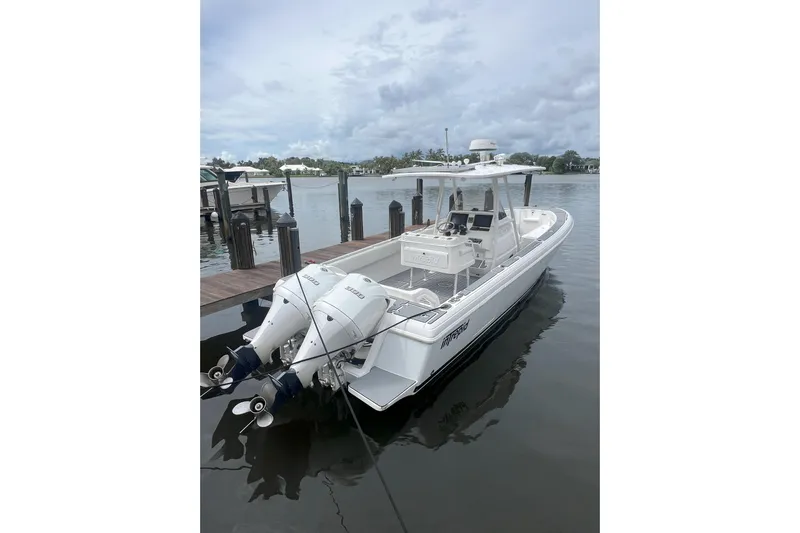  Yacht Photos Pics 2011 Intrepid 323 Cuddy boat docked with dual outboard engines.