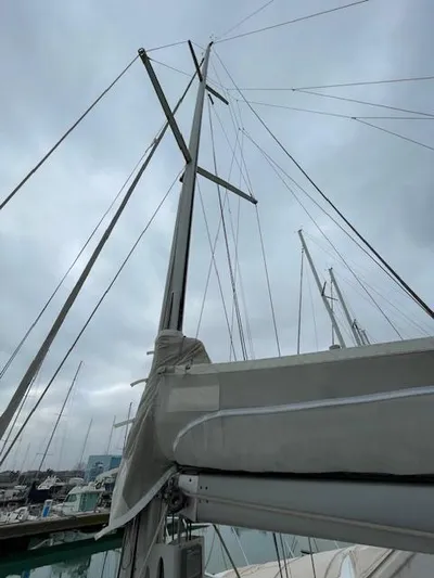 Yacht Photos Pics Beneteau First 40.7 sailboat mast and rigging against cloudy sky, 2008 model.