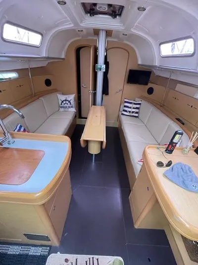 Yacht Photos Pics Interior of 2008 Beneteau First 40.7 sailboat with modern furnishings and cozy seating.