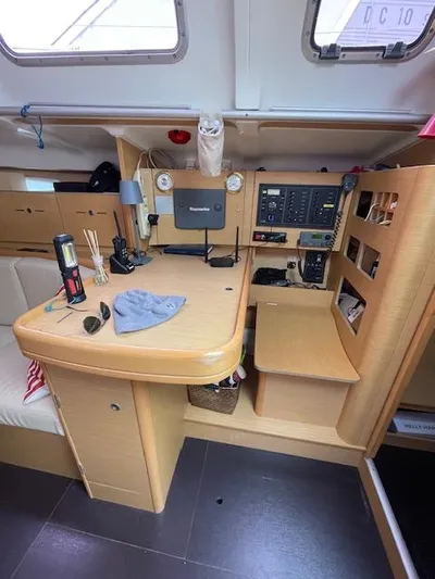  Yacht Photos Pics Interior of 2008 Beneteau First 40.7 sailboat, featuring navigation station and control panel.