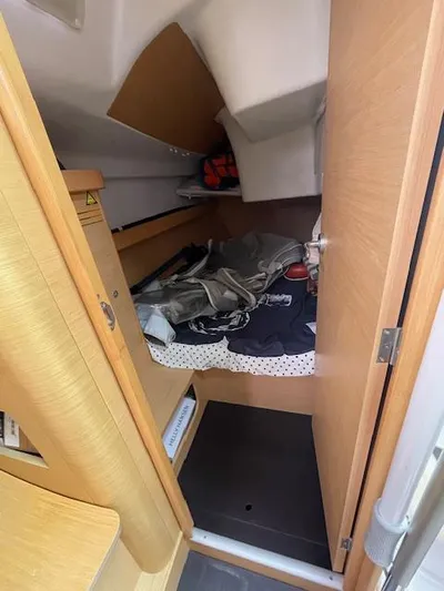  Yacht Photos Pics Cabin interior of 2008 Beneteau First 40.7 sailboat with storage and bedding.