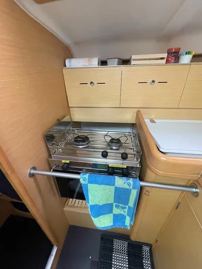  Yacht Photos Pics Interior of 2008 Beneteau First 40.7 yacht kitchen with stove and storage cabinets.