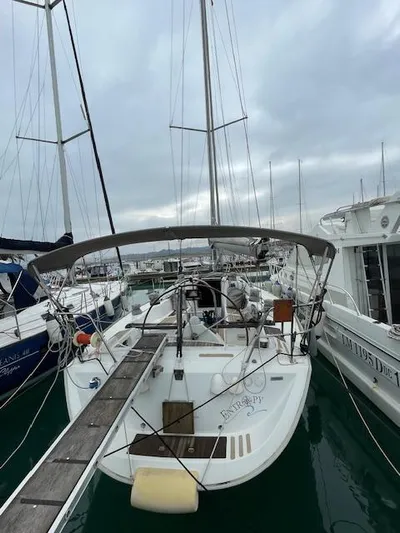  Yacht Photos Pics 2008 Beneteau First 40.7 sailboat docked in a marina, overcast sky.