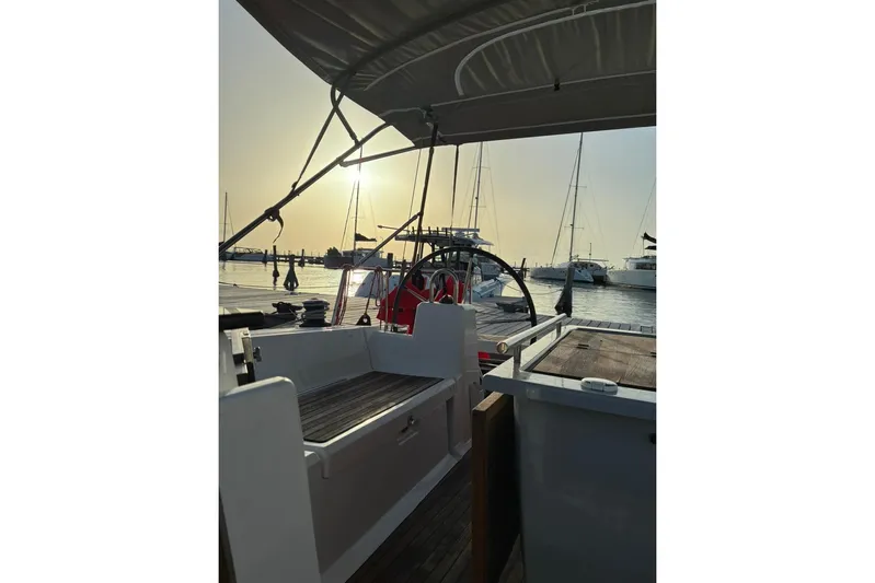 Mar III Yacht Photos Pics Beneteau Oceanis 41.1 sailboat cockpit at sunset, docked in marina, 2020 model.