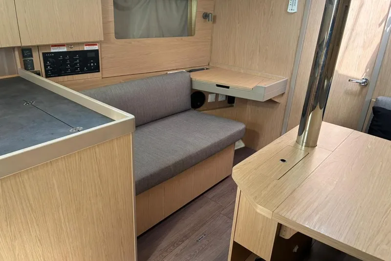 Mar III Yacht Photos Pics Interior of 2020 Beneteau Oceanis 41.1 yacht with modern wood finish and seating area.