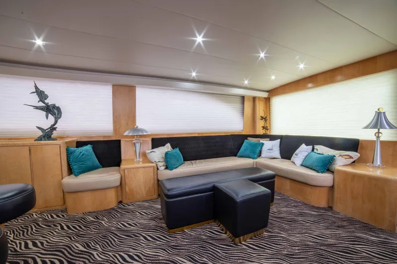 Crushing It Yacht Photos Pics Luxurious interior of 1996 Donzi 72 Custom Convertible yacht with modern seating and decor.