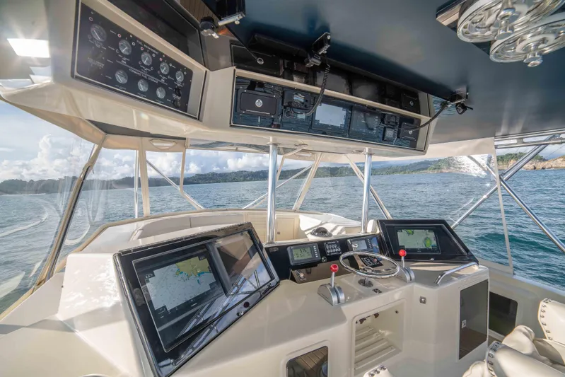 Crushing It Yacht Photos Pics 1996 Donzi 72 Custom Convertible yacht cockpit with advanced navigation systems.