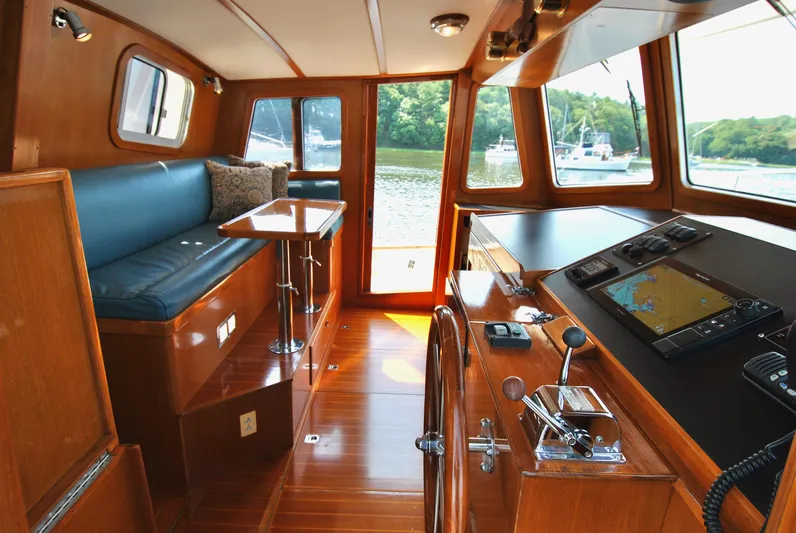 Valiant Yacht Photos Pics 2004 Transpacific Marine Eagle 40 interior with helm, navigation equipment, and seating area.