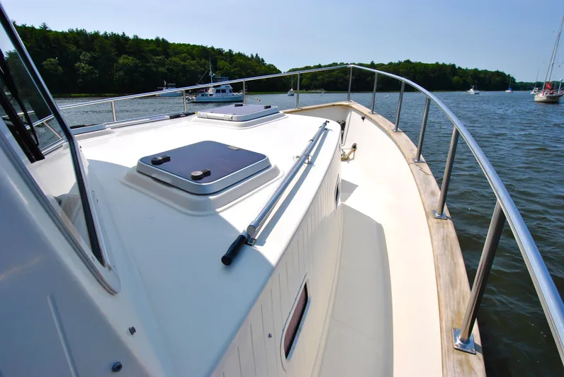 Valiant Yacht Photos Pics 2004 Transpacific Marine Eagle 40 yacht deck on a sunny day, surrounded by water.