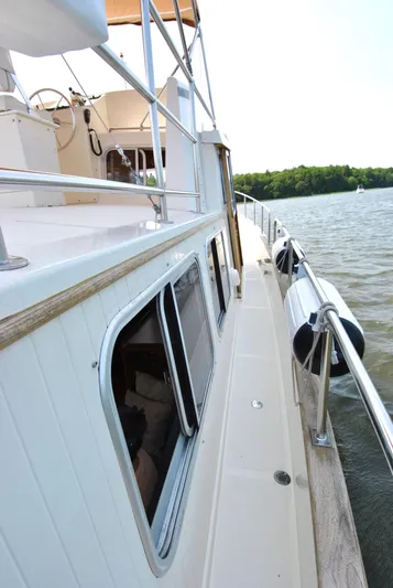 Valiant Yacht Photos Pics 2004 Transpacific Marine Eagle 40 yacht on water, side view with railing and windows.