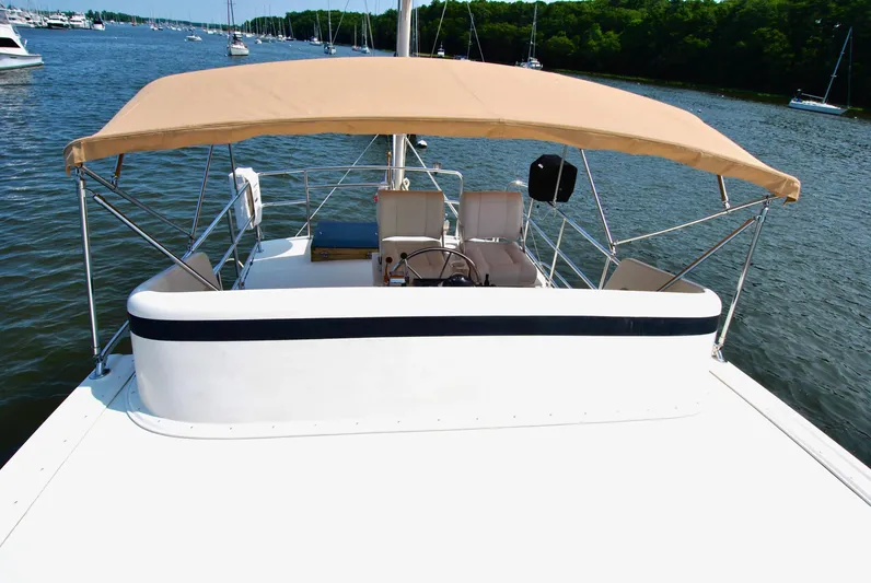 Valiant Yacht Photos Pics 2004 Transpacific Marine Eagle 40 yacht with canopy on calm water.