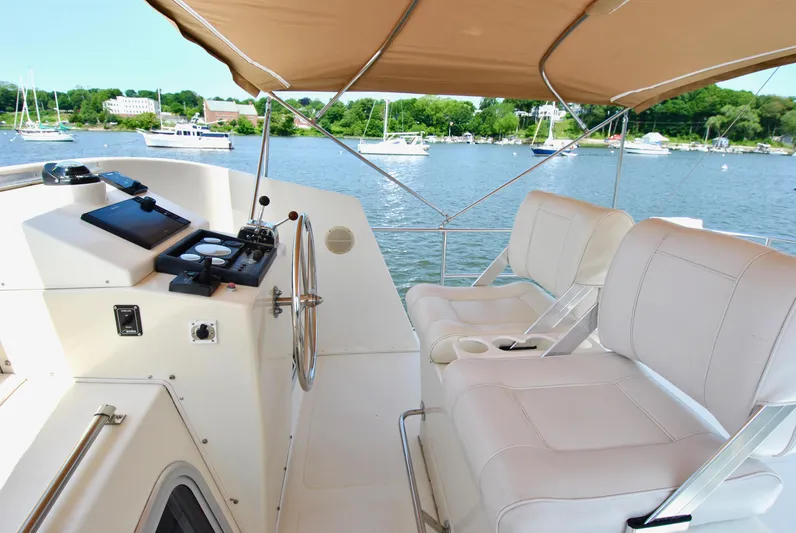 Valiant Yacht Photos Pics 2004 Transpacific Marine Eagle 40 yacht helm with dual seats and scenic water view.