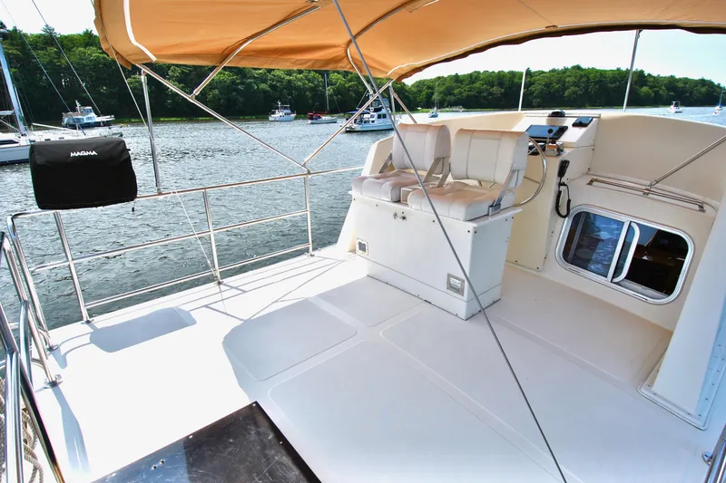 Valiant Yacht Photos Pics 2004 Transpacific Marine Eagle 40 yacht deck with seating and helm, docked on a sunny day.