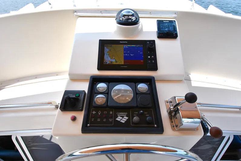 Valiant Yacht Photos Pics Control panel of 2004 Transpacific Marine Eagle 40 yacht with navigation instruments and throttle.
