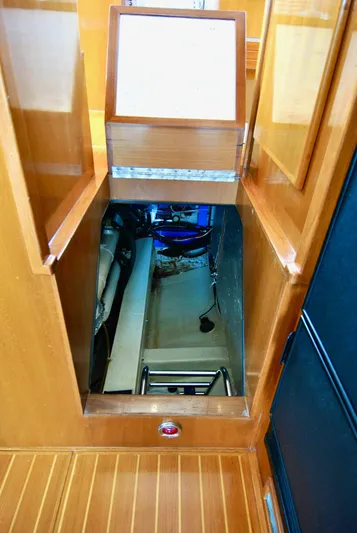 Valiant Yacht Photos Pics Engine compartment access on 2004 Transpacific Marine Eagle 40 boat, featuring wooden interior.