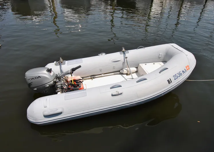 Valiant Yacht Photos Pics Inflatable boat with Honda motor, floating on water, Transpacific Marine Eagle 40, 2004 model.