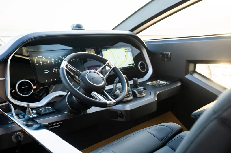 Masie Yacht Photos Pics Modern helm of 2023 Pearl 62 yacht with advanced navigation displays and controls.