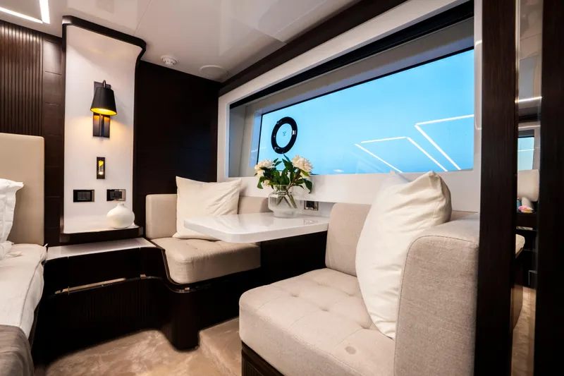 Masie Yacht Photos Pics Luxurious interior of 2023 Pearl 62 yacht with elegant seating and modern decor.