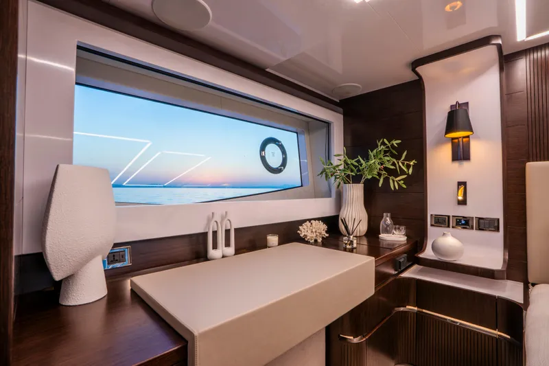 Masie Yacht Photos Pics Luxurious interior of 2023 Pearl 62 yacht with elegant decor and ocean view.
