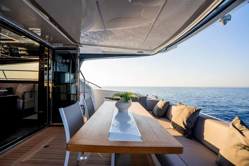 Masie Yacht Photos Pics Luxurious Pearl 62 yacht deck with elegant seating, ocean view, and modern design, 2023 model.
