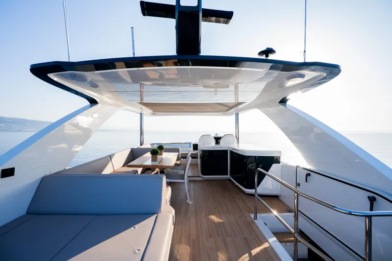 Masie Yacht Photos Pics Luxurious 2023 Pearl 62 yacht interior with modern seating and ocean view.