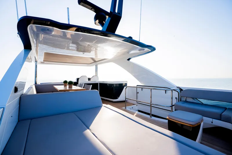 Masie Yacht Photos Pics Luxurious 2023 Pearl 62 yacht deck with modern seating and ocean view.