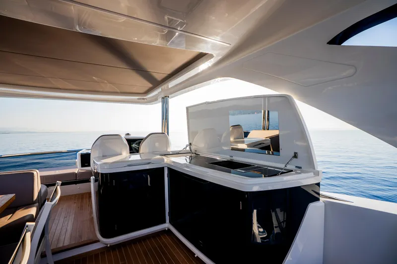 Masie Yacht Photos Pics Luxurious 2023 Pearl 62 yacht interior with modern design and ocean view.